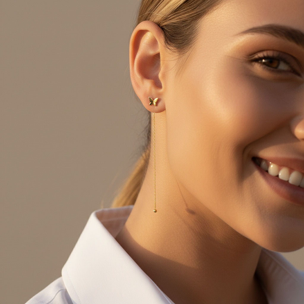 Aimeé - Örhängen med tasseldesign och fjäril