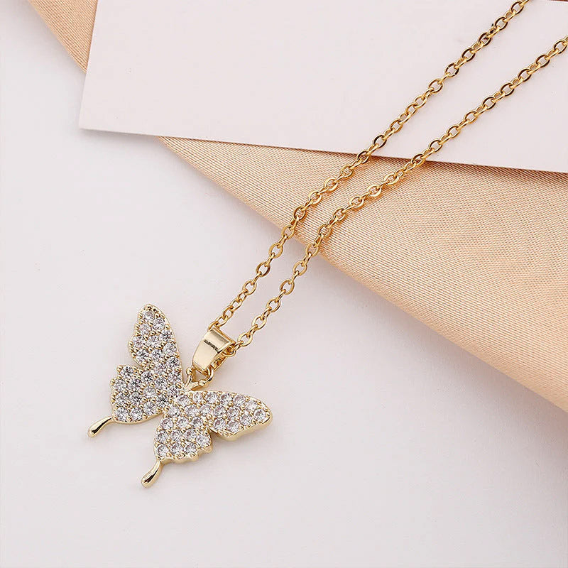 Wings of Gold - Halsband med glittrande fjäril