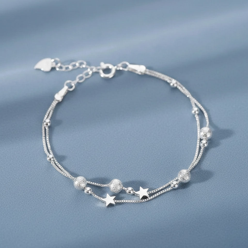 Nova - Armband med dubbla kedjor och kosmiskt motiv