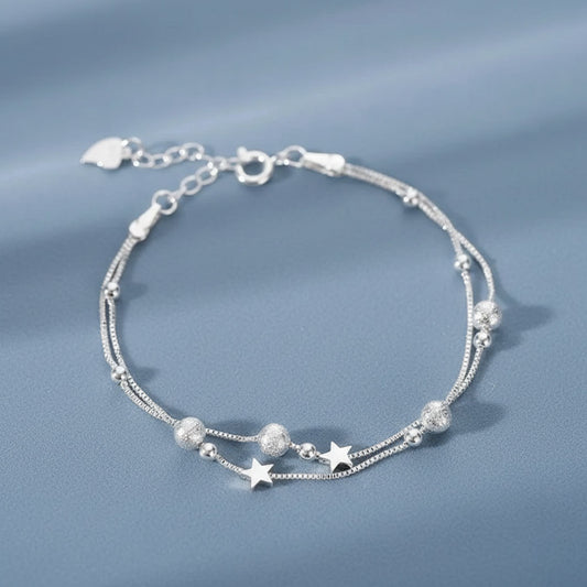 Nova - Armband med dubbla kedjor och kosmiskt motiv