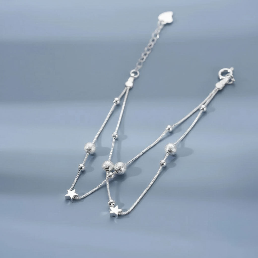 Nova - Armband med dubbla kedjor och kosmiskt motiv