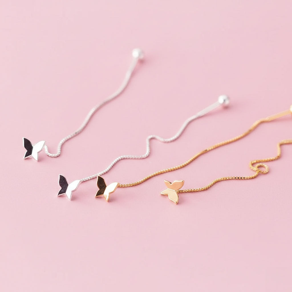 Aimeé - Örhängen med tasseldesign och fjäril