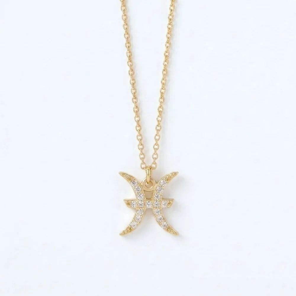 Constella guldtonat pisces halsband med stjärntecken och glittrande klara stenar längs kanterna