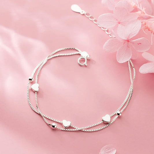 Evelyn - Armband med dubbla kedjor och små hjärtan