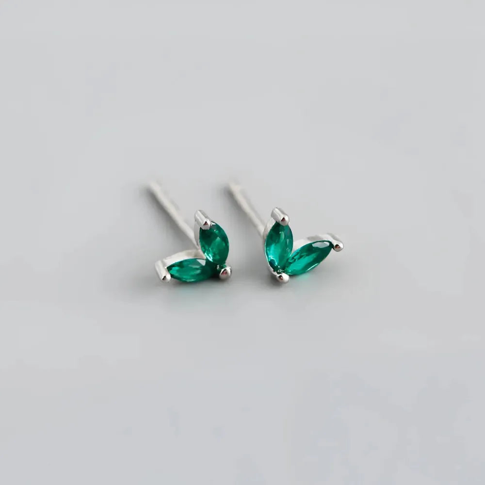 Delicate silver Lovebirds studs with three vibrant green marquise-cut stones in a leaf-like design