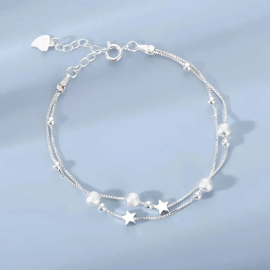 Nova - Armband med dubbla kedjor och kosmiskt motiv